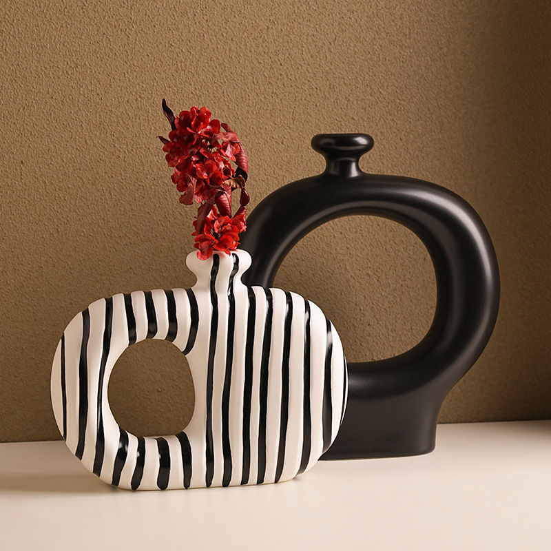 Black and white striped ceramic vase